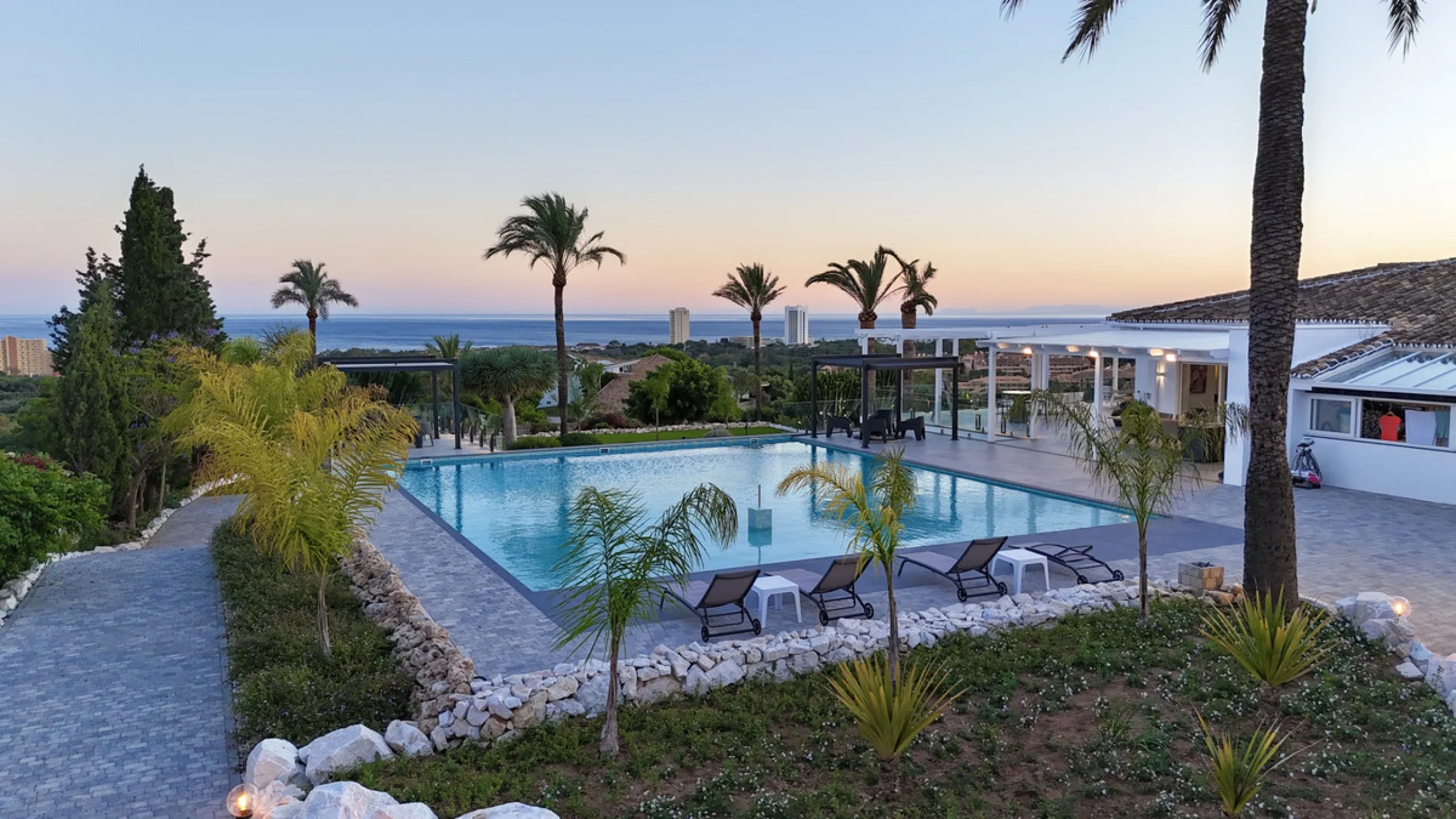 Set on two generous plots totalling 6.128 m², this private and peaceful luxury villa offers a rare blend of modern Mediterranean style and natural beauty in Elviria, Marbella East. Surrounded by its own unspoilt land on one side, the property enjoys excep