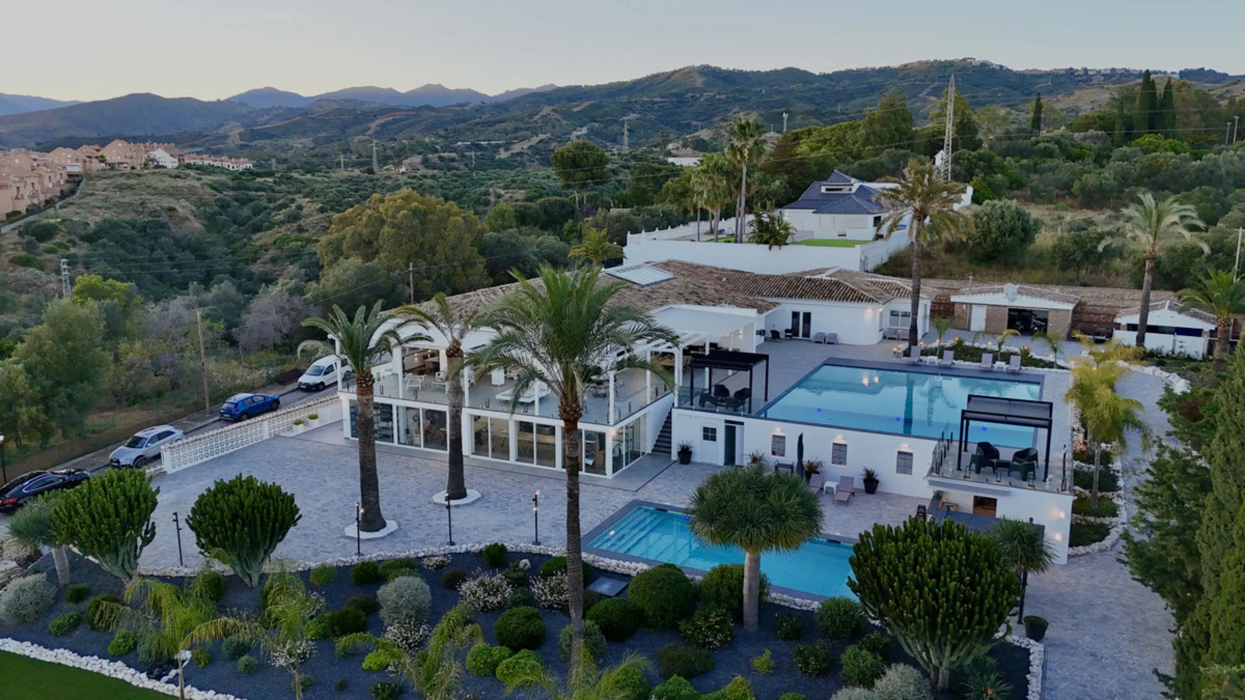 Set on two generous plots totalling 6.128 m², this private and peaceful luxury villa offers a rare blend of modern Mediterranean style and natural beauty in Elviria, Marbella East. Surrounded by its own unspoilt land on one side, the property enjoys excep