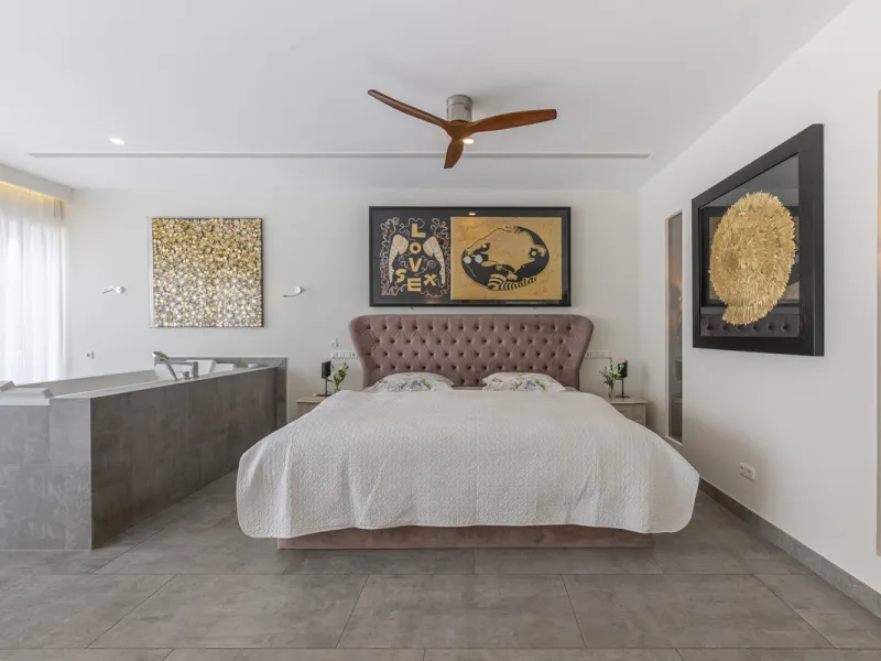 Set on two generous plots totalling 6.128 m², this private and peaceful luxury villa offers a rare blend of modern Mediterranean style and natural beauty in Elviria, Marbella East. Surrounded by its own unspoilt land on one side, the property enjoys excep