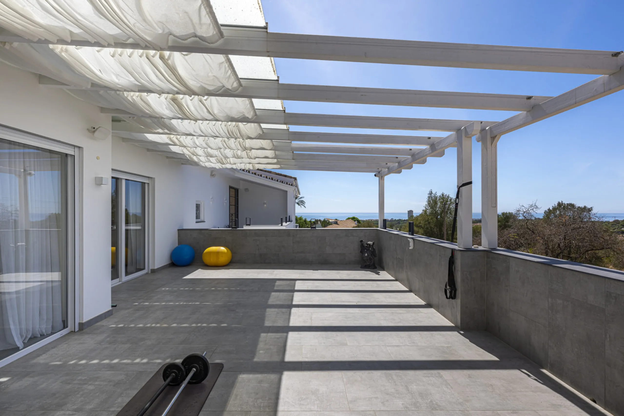 Set on two generous plots totalling 6.128 m², this private and peaceful luxury villa offers a rare blend of modern Mediterranean style and natural beauty in Elviria, Marbella East. Surrounded by its own unspoilt land on one side, the property enjoys excep