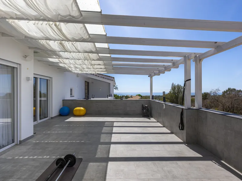Set on two generous plots totalling 6.128 m², this private and peaceful luxury villa offers a rare blend of modern Mediterranean style and natural beauty in Elviria, Marbella East. Surrounded by its own unspoilt land on one side, the property enjoys excep