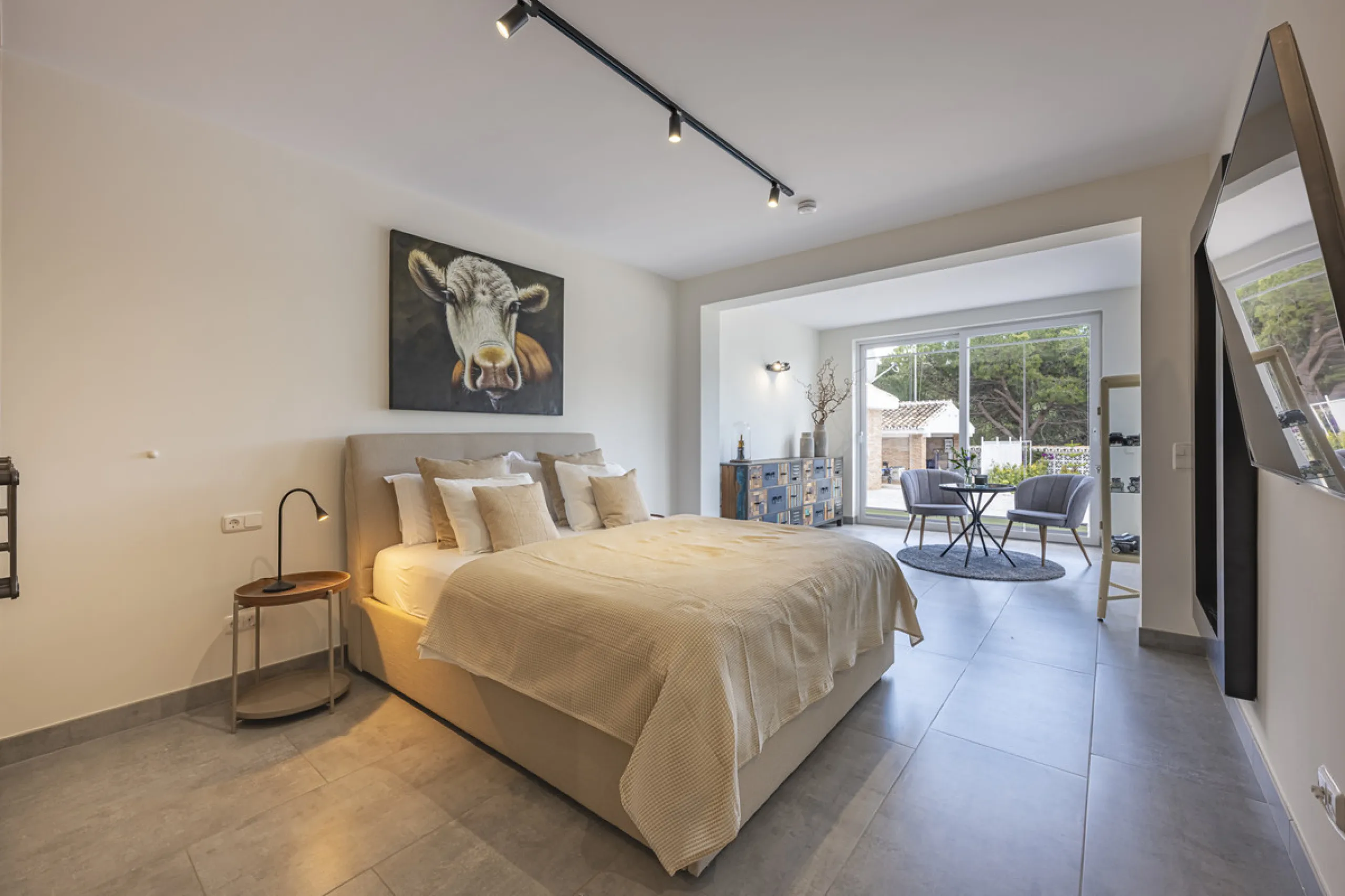 Set on two generous plots totalling 6.128 m², this private and peaceful luxury villa offers a rare blend of modern Mediterranean style and natural beauty in Elviria, Marbella East. Surrounded by its own unspoilt land on one side, the property enjoys excep