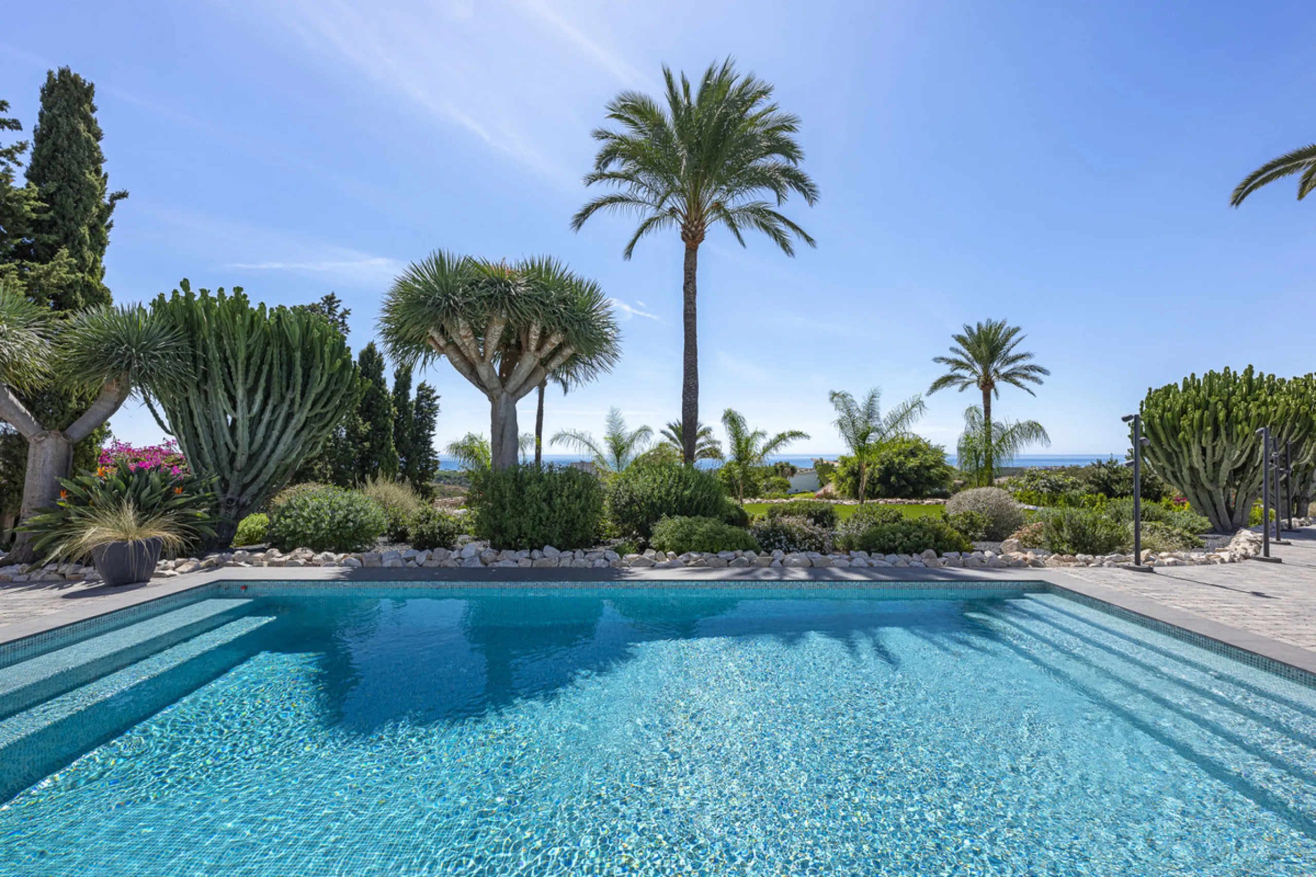 Set on two generous plots totalling 6.128 m², this private and peaceful luxury villa offers a rare blend of modern Mediterranean style and natural beauty in Elviria, Marbella East. Surrounded by its own unspoilt land on one side, the property enjoys excep