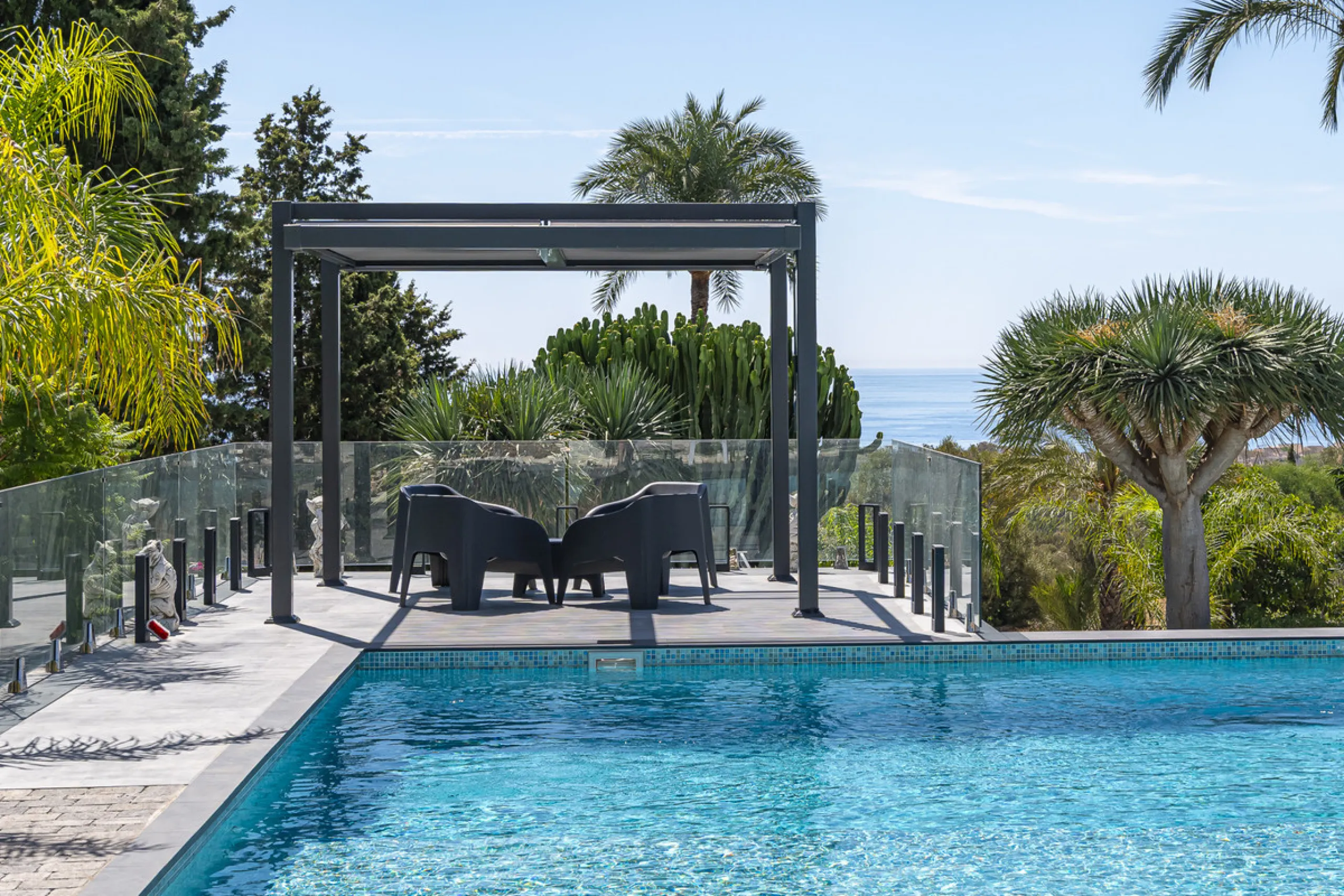 Set on two generous plots totalling 6.128 m², this private and peaceful luxury villa offers a rare blend of modern Mediterranean style and natural beauty in Elviria, Marbella East. Surrounded by its own unspoilt land on one side, the property enjoys excep
