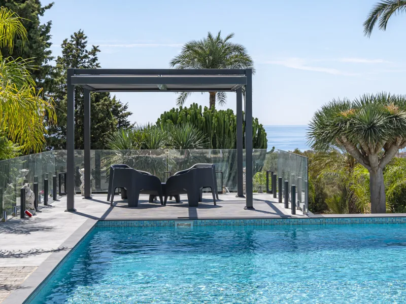 Set on two generous plots totalling 6.128 m², this private and peaceful luxury villa offers a rare blend of modern Mediterranean style and natural beauty in Elviria, Marbella East. Surrounded by its own unspoilt land on one side, the property enjoys excep