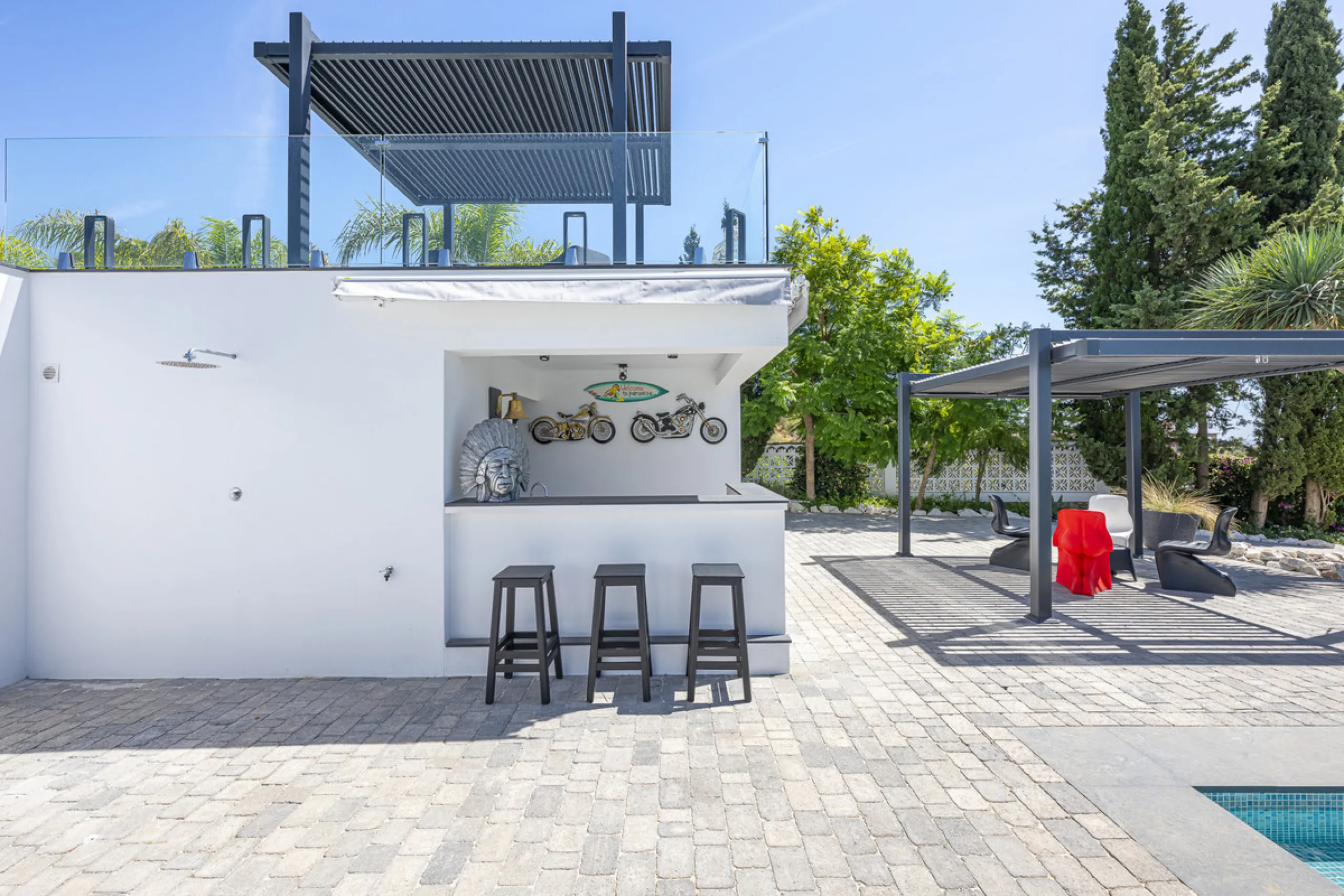 Set on two generous plots totalling 6.128 m², this private and peaceful luxury villa offers a rare blend of modern Mediterranean style and natural beauty in Elviria, Marbella East. Surrounded by its own unspoilt land on one side, the property enjoys excep