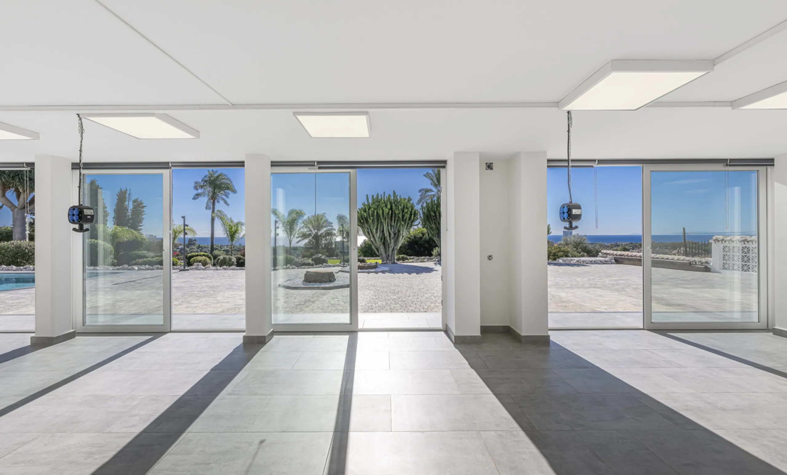 Set on two generous plots totalling 6.128 m², this private and peaceful luxury villa offers a rare blend of modern Mediterranean style and natural beauty in Elviria, Marbella East. Surrounded by its own unspoilt land on one side, the property enjoys excep