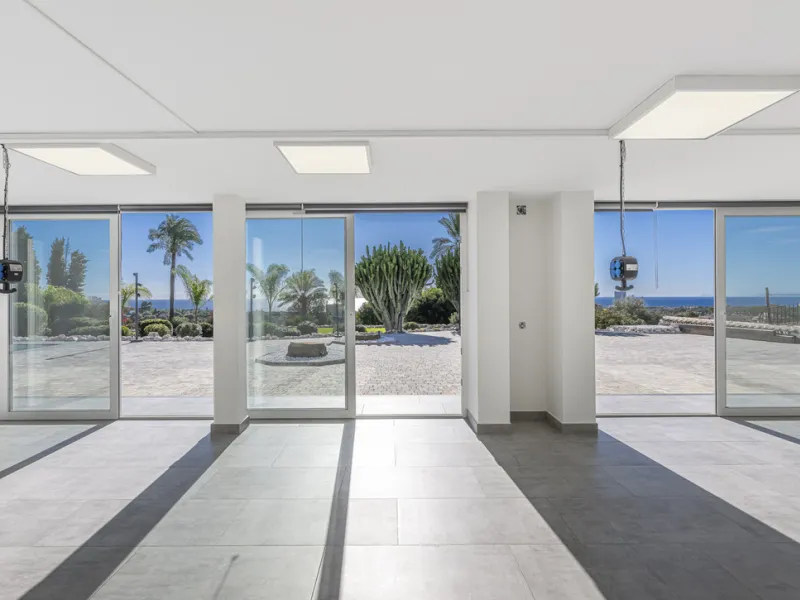 Set on two generous plots totalling 6.128 m², this private and peaceful luxury villa offers a rare blend of modern Mediterranean style and natural beauty in Elviria, Marbella East. Surrounded by its own unspoilt land on one side, the property enjoys excep