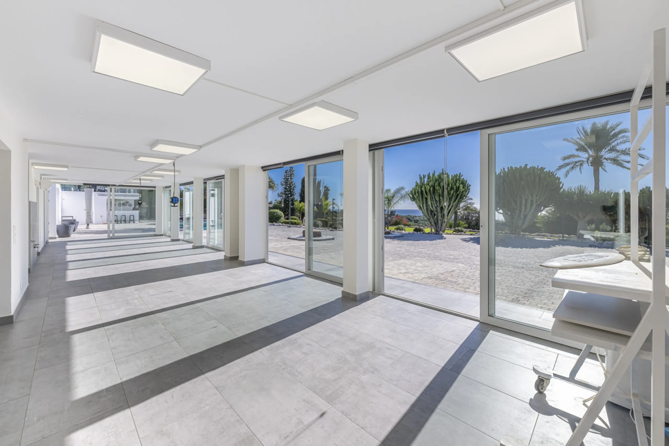 Set on two generous plots totalling 6.128 m², this private and peaceful luxury villa offers a rare blend of modern Mediterranean style and natural beauty in Elviria, Marbella East. Surrounded by its own unspoilt land on one side, the property enjoys excep