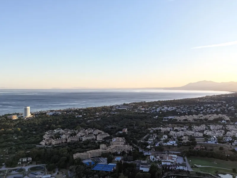Set on two generous plots totalling 6.128 m², this private and peaceful luxury villa offers a rare blend of modern Mediterranean style and natural beauty in Elviria, Marbella East. Surrounded by its own unspoilt land on one side, the property enjoys excep