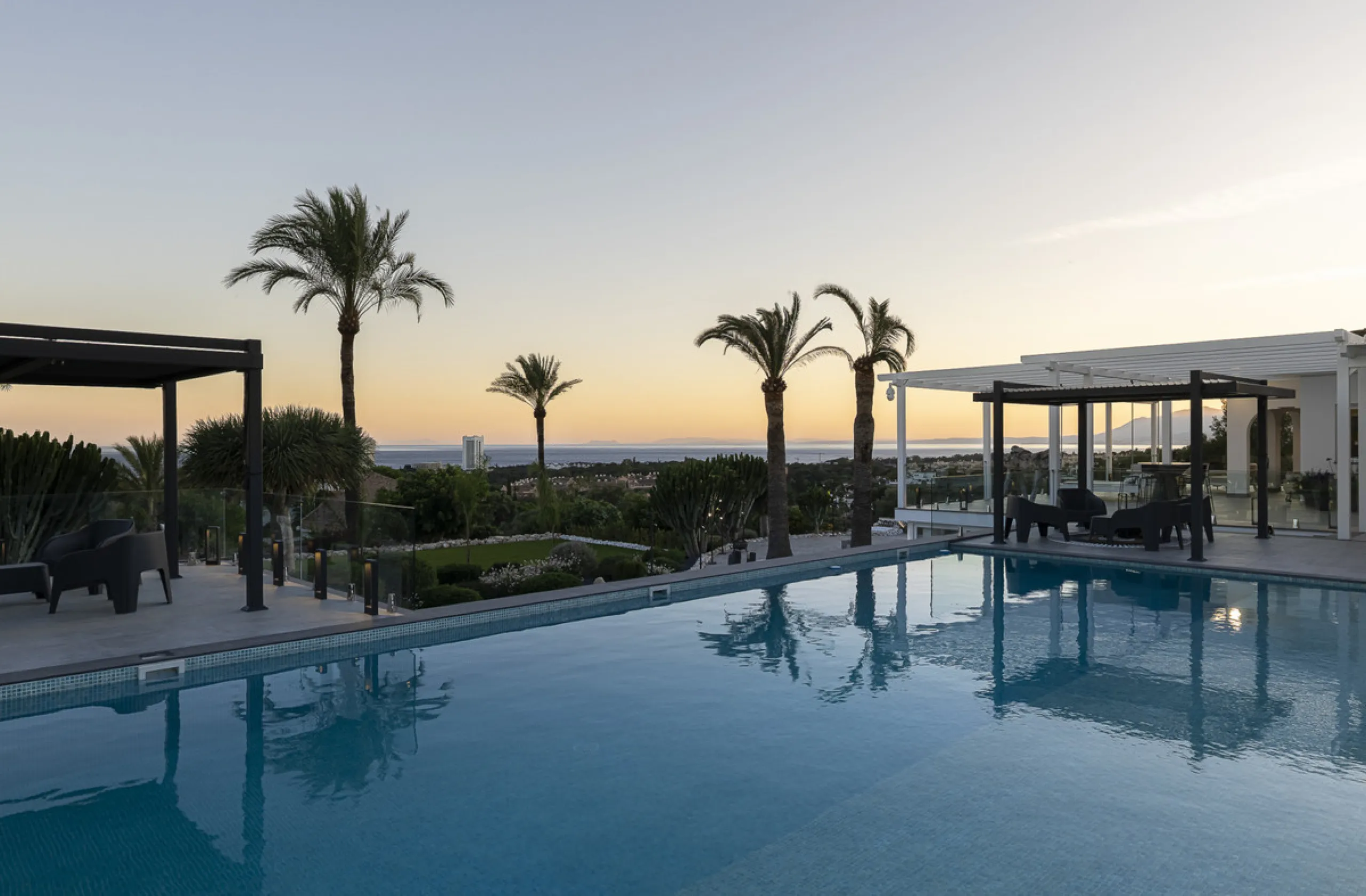 Set on two generous plots totalling 6.128 m², this private and peaceful luxury villa offers a rare blend of modern Mediterranean style and natural beauty in Elviria, Marbella East. Surrounded by its own unspoilt land on one side, the property enjoys excep