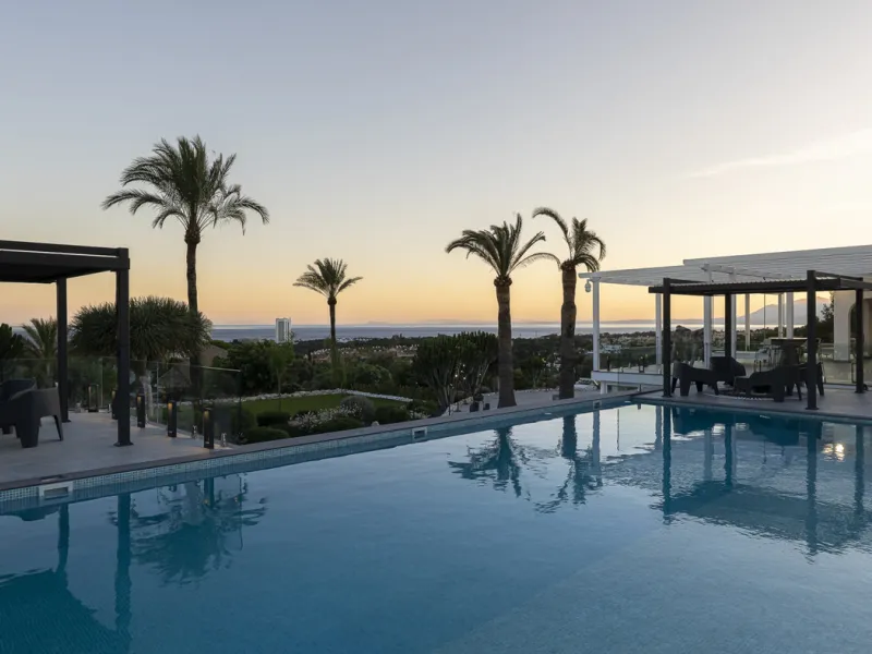 Set on two generous plots totalling 6.128 m², this private and peaceful luxury villa offers a rare blend of modern Mediterranean style and natural beauty in Elviria, Marbella East. Surrounded by its own unspoilt land on one side, the property enjoys excep