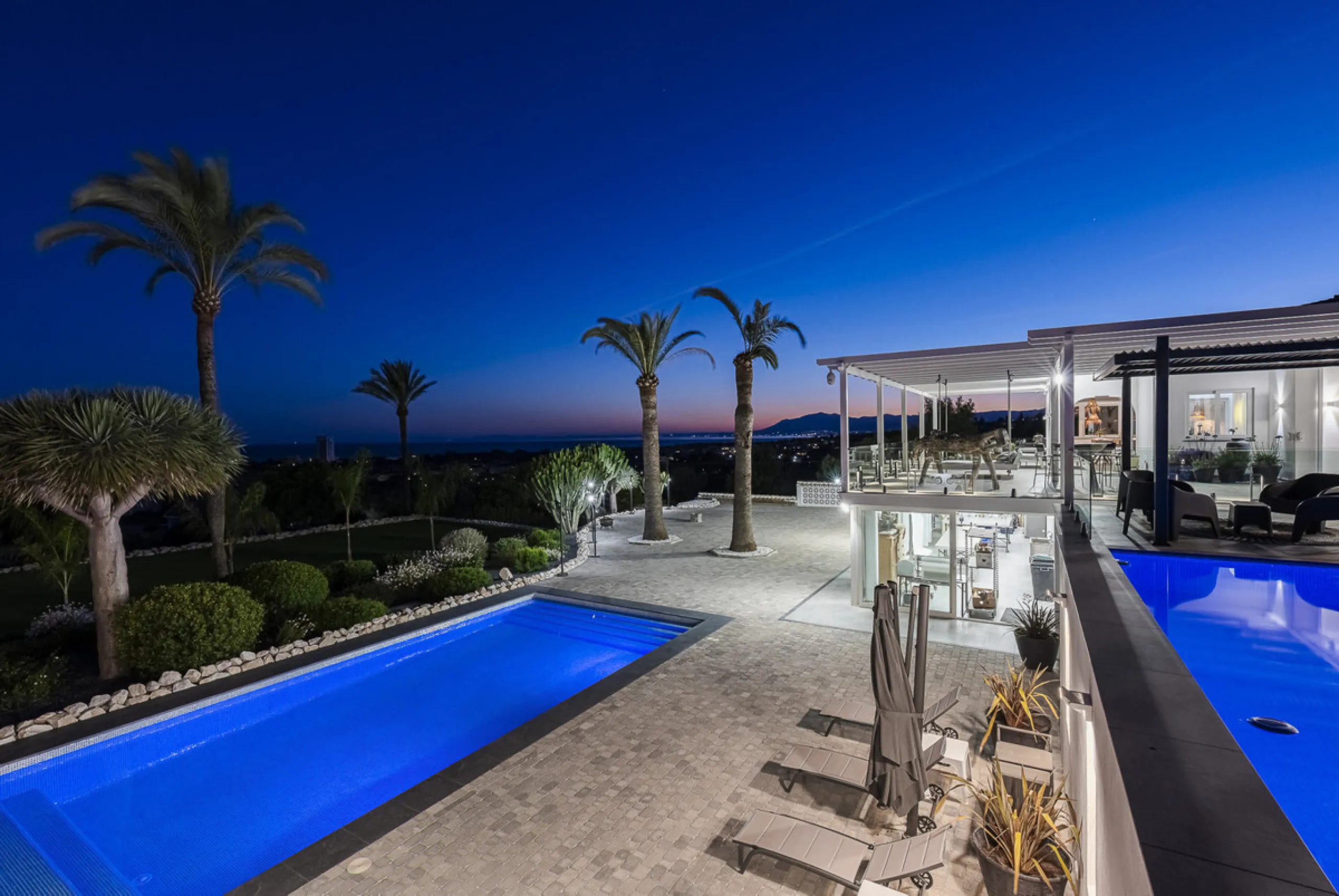 Set on two generous plots totalling 6.128 m², this private and peaceful luxury villa offers a rare blend of modern Mediterranean style and natural beauty in Elviria, Marbella East. Surrounded by its own unspoilt land on one side, the property enjoys excep
