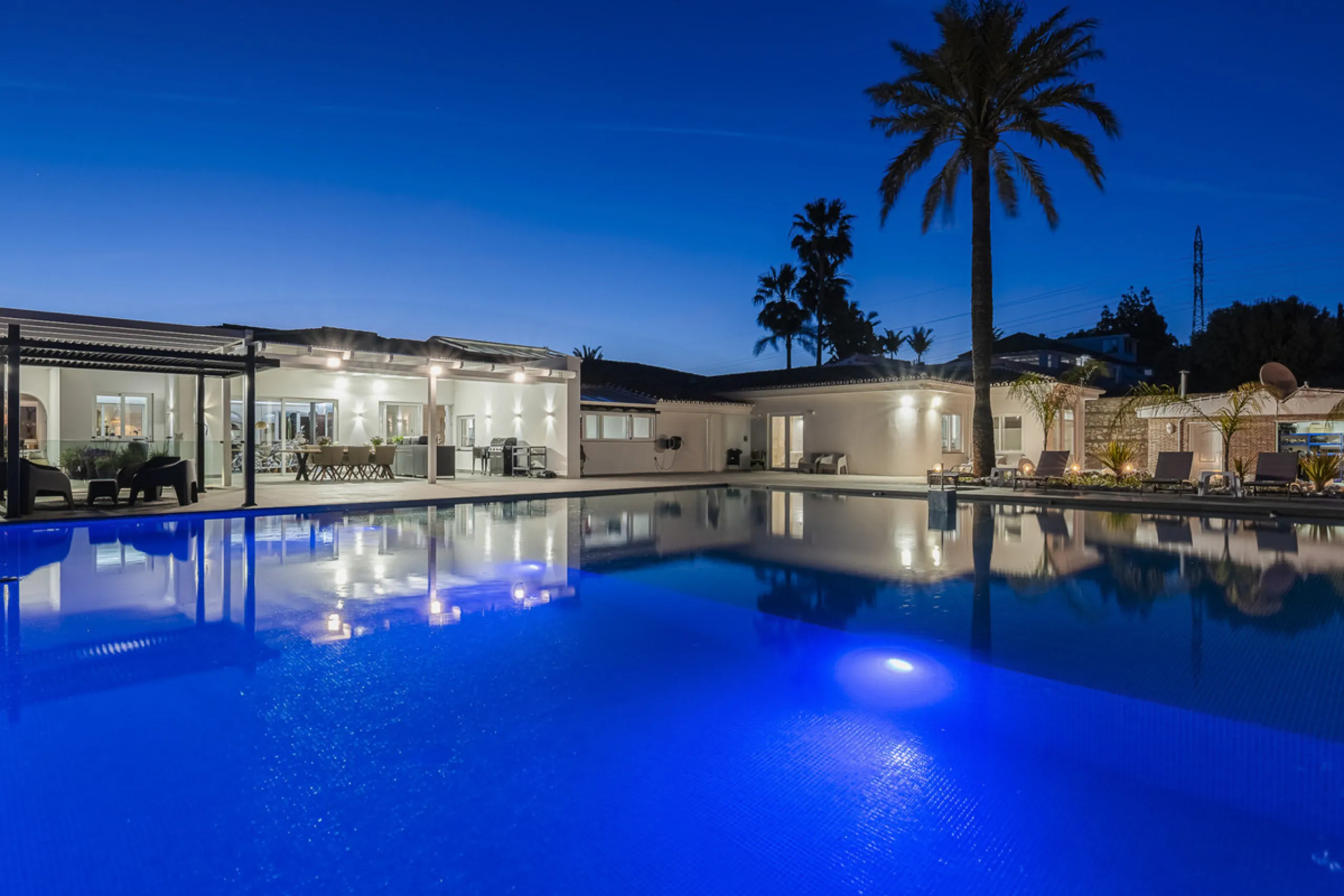 Set on two generous plots totalling 6.128 m², this private and peaceful luxury villa offers a rare blend of modern Mediterranean style and natural beauty in Elviria, Marbella East. Surrounded by its own unspoilt land on one side, the property enjoys excep