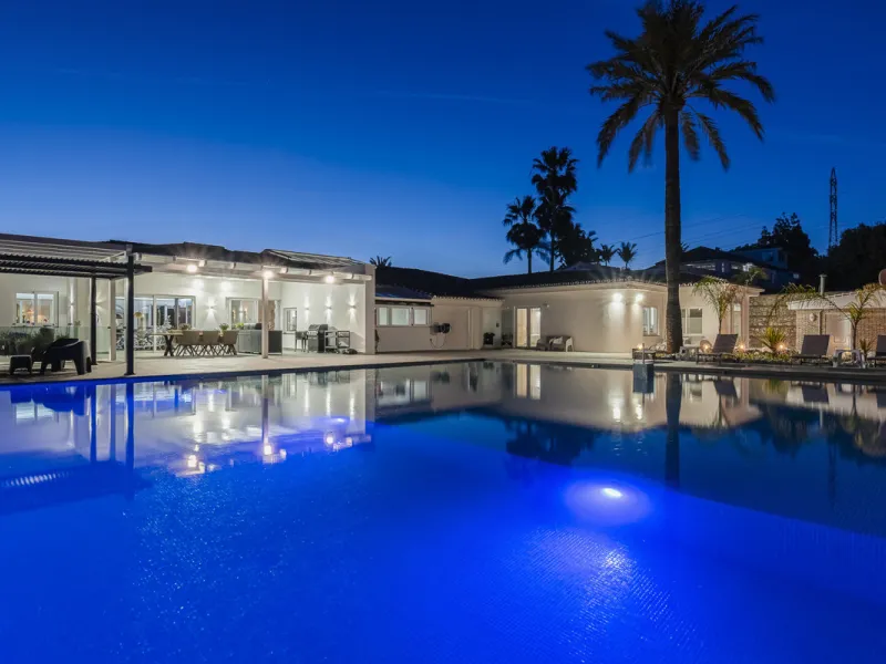 Set on two generous plots totalling 6.128 m², this private and peaceful luxury villa offers a rare blend of modern Mediterranean style and natural beauty in Elviria, Marbella East. Surrounded by its own unspoilt land on one side, the property enjoys excep