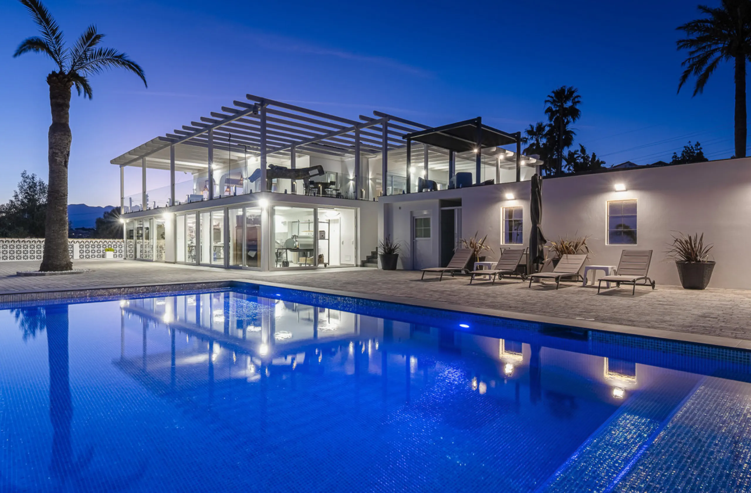 Set on two generous plots totalling 6.128 m², this private and peaceful luxury villa offers a rare blend of modern Mediterranean style and natural beauty in Elviria, Marbella East. Surrounded by its own unspoilt land on one side, the property enjoys excep
