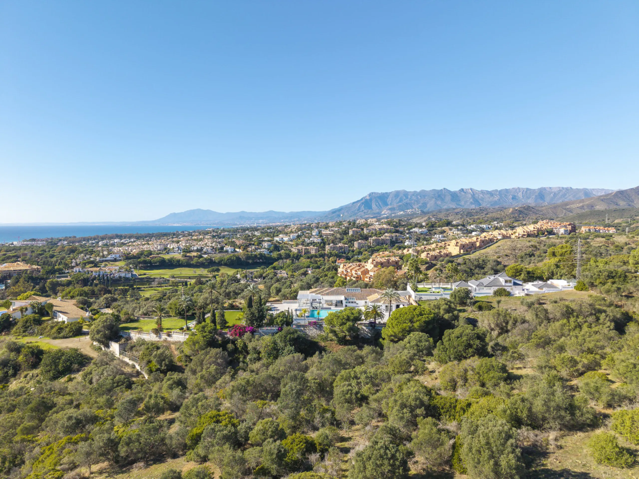 Set on two generous plots totalling 6.128 m², this private and peaceful luxury villa offers a rare blend of modern Mediterranean style and natural beauty in Elviria, Marbella East. Surrounded by its own unspoilt land on one side, the property enjoys excep