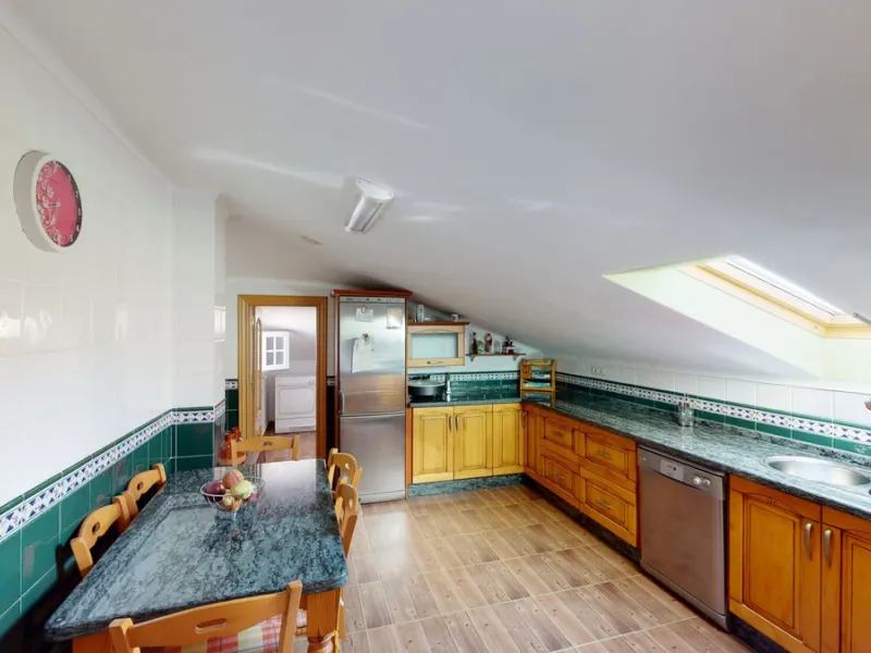 This well-located spacious villa offers the possibility for two families to live separately. The garage of 217 m2 has room for 5 cars, an office and storage space. Entrance to the garden with nice pool, shower, fruit trees and henhouse. Separate room with