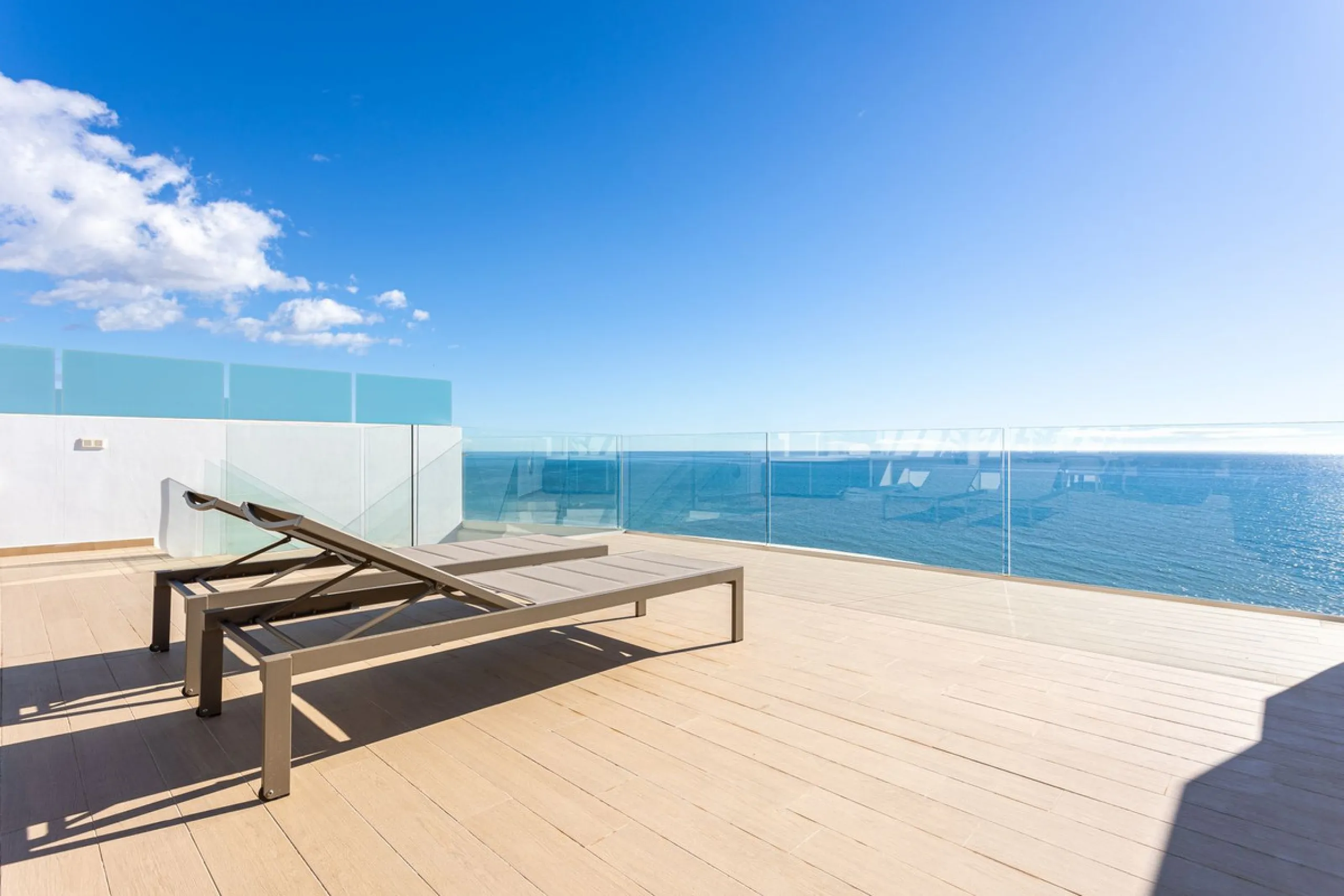 Would you like to live just few steps from the beach, feel the waves at your terrace and enjoy your own roof top solarium, look over the rooftops and feel the sea breeze? This exclusive penthouse apartment is located in one of the finest new builds called