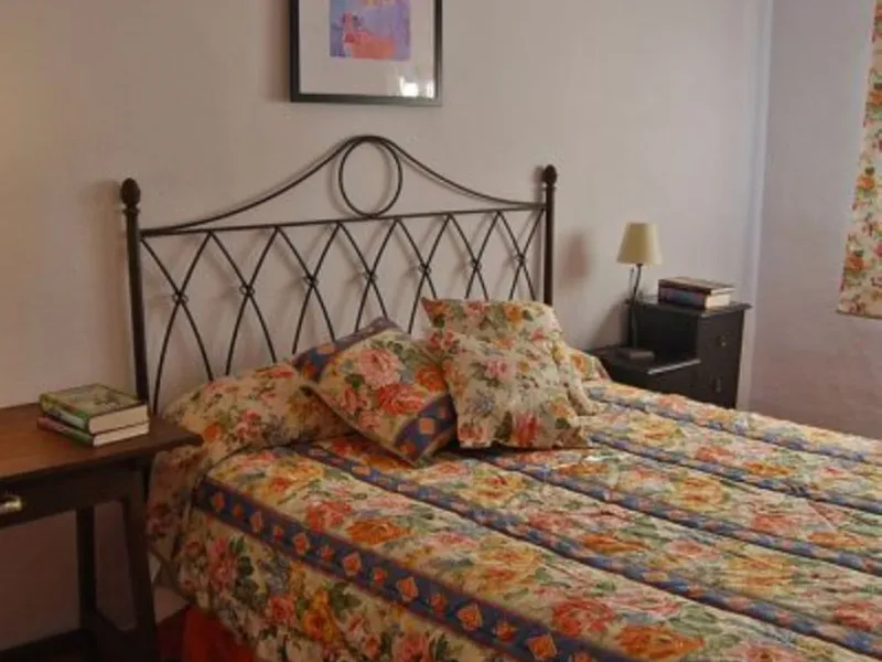 Andalusian Villa located on a plot of 12,000 square meters. With a 3000 m2 garden, mature with some trees over 100 years old, close to schools and shops, with easy access to the highway and close to Malaga airport.