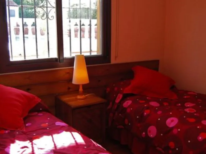 Andalusian Villa located on a plot of 12,000 square meters. With a 3000 m2 garden, mature with some trees over 100 years old, close to schools and shops, with easy access to the highway and close to Malaga airport.