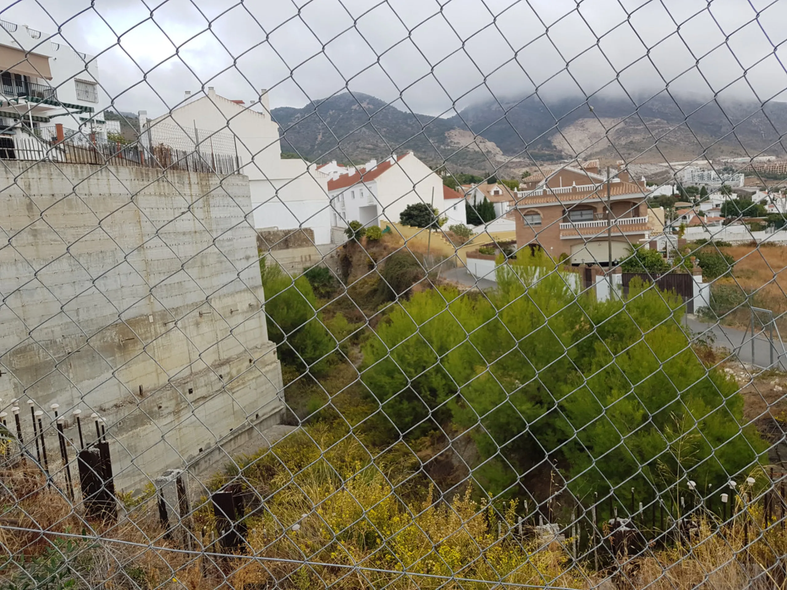 Bank repossessed urban land designated for the construction of up to 22 single family homes or a two storey building situated in the centre of Benalmadena Pueblo.