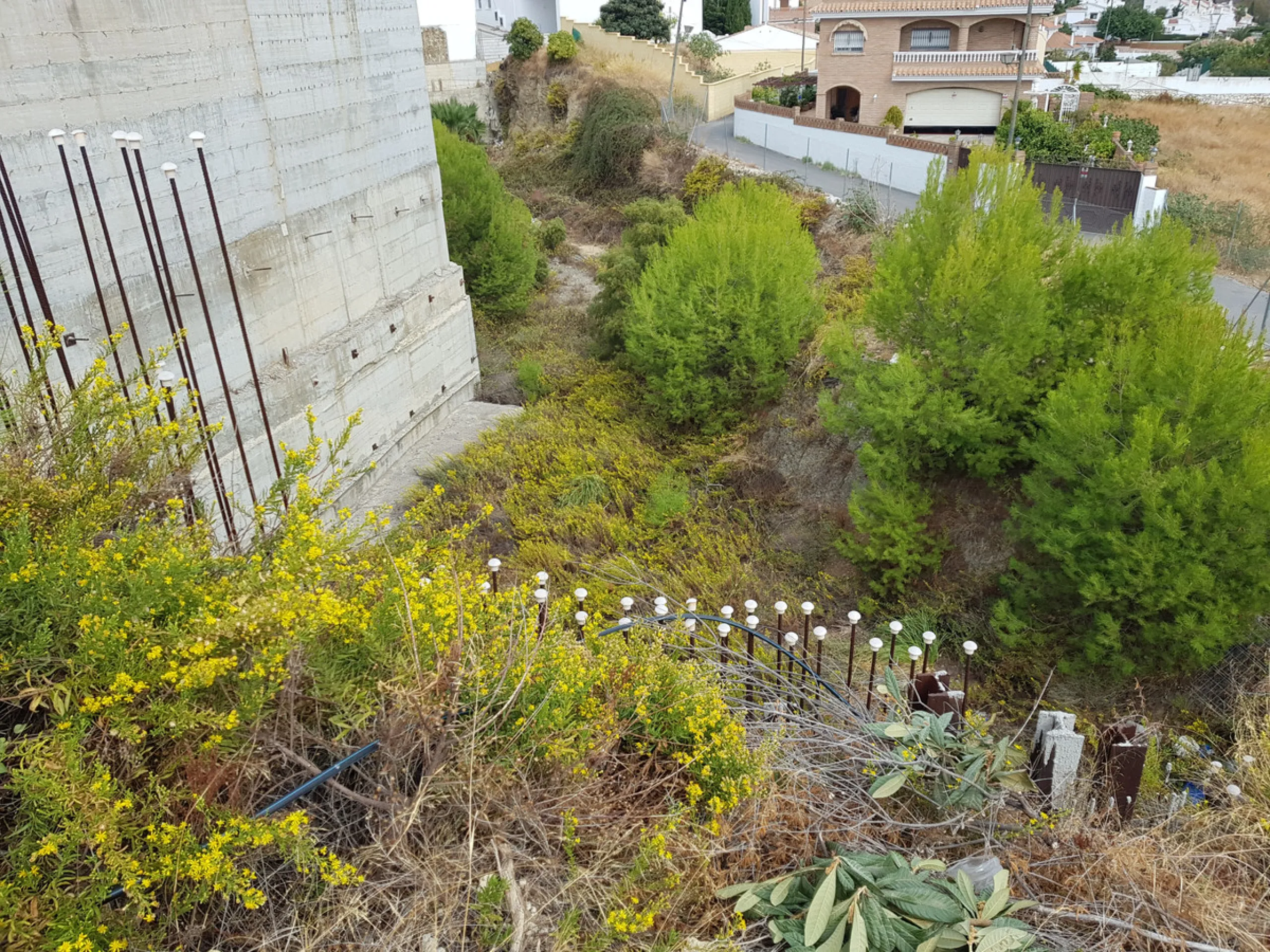 Bank repossessed urban land designated for the construction of up to 22 single family homes or a two storey building situated in the centre of Benalmadena Pueblo.