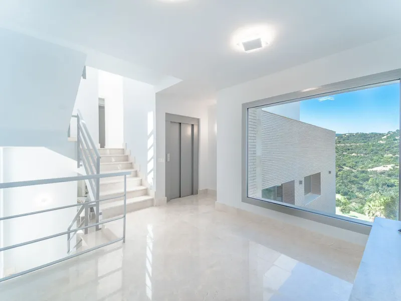 Newly built contemporary villa, finished on two floors plus basement, plus roof top, accessible by stairs and elevator. It is located in a natural environment, surrounded by golf and mountain, providing nice open views to those, panoramic sea view from th
