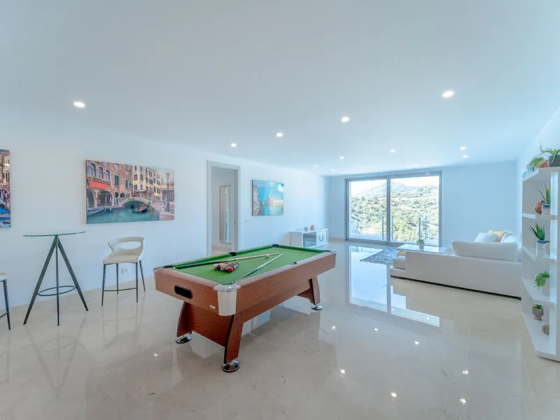 Newly built contemporary villa, finished on two floors plus basement, plus roof top, accessible by stairs and elevator. It is located in a natural environment, surrounded by golf and mountain, providing nice open views to those, panoramic sea view from th