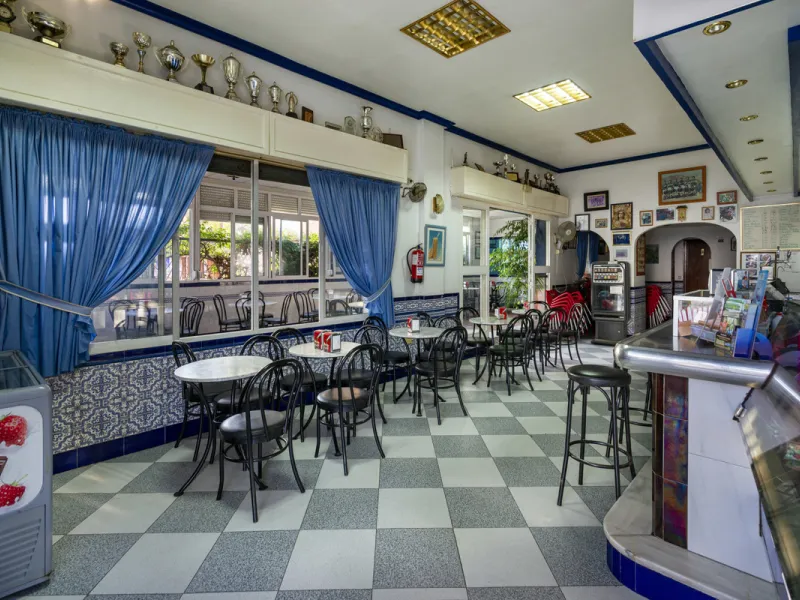 Freehold large lock up commercial unit. Available for the first time since new. Owner retiring after 31 years of running a successful bar cafeteria. Building can continue as a bar restaurant. Fully equipped with many covers and a large street terrace. The