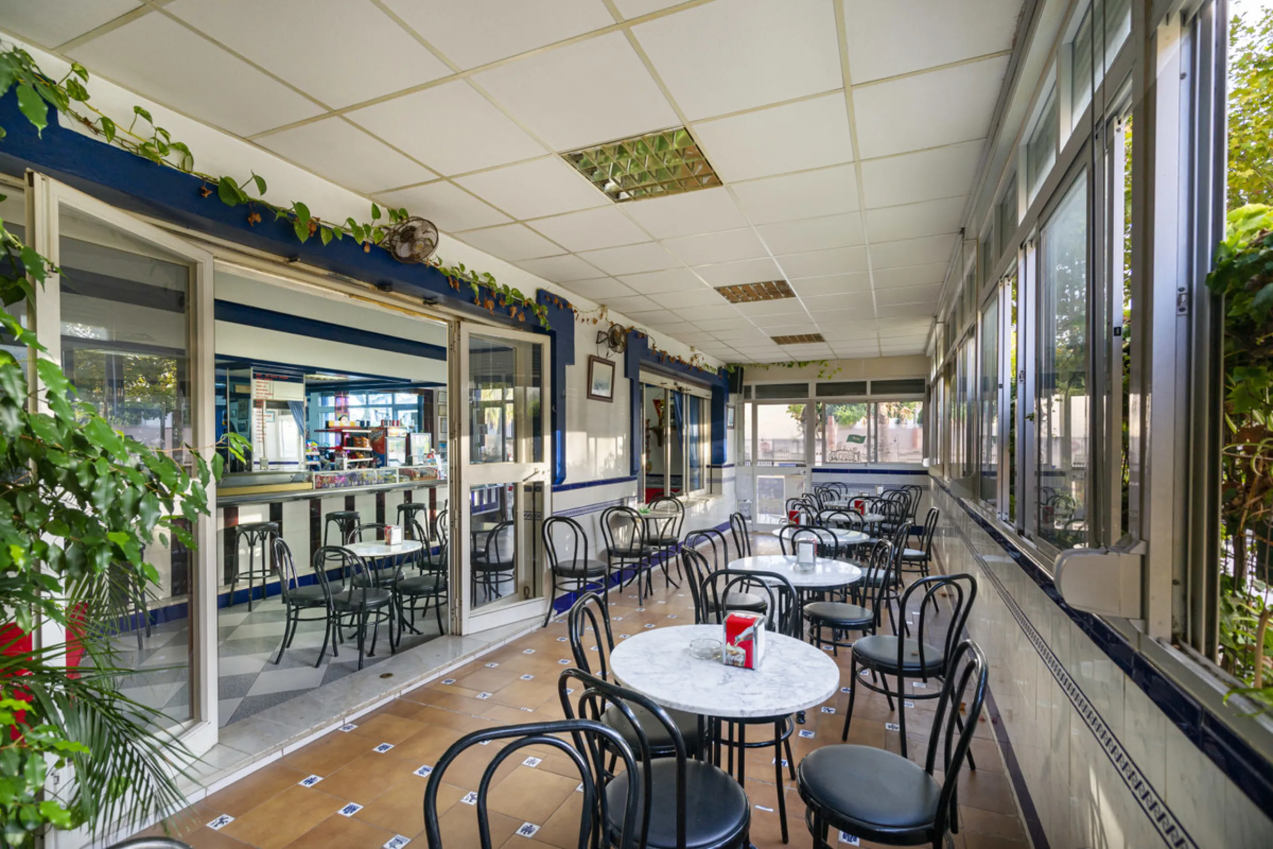 Freehold large lock up commercial unit. Available for the first time since new. Owner retiring after 31 years of running a successful bar cafeteria. Building can continue as a bar restaurant. Fully equipped with many covers and a large street terrace. The