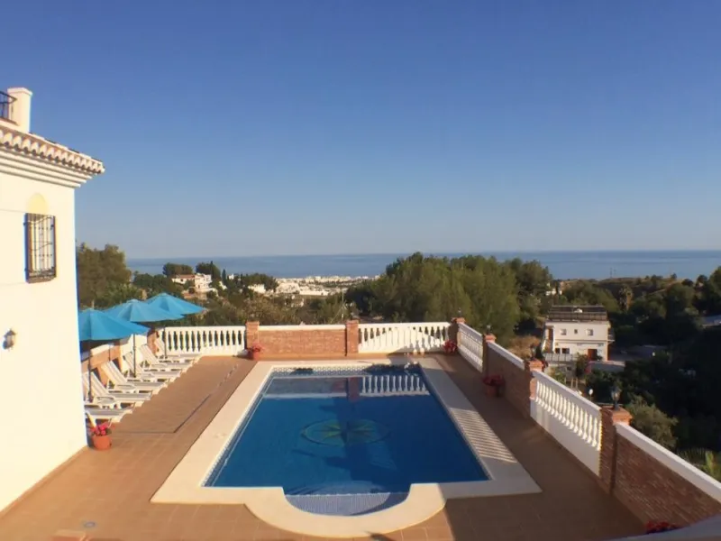 Nestled in the serene and sought-after community of Cortijos San Rafael, just off the Frigiliana road near Nerja, this outstanding detached villa—completed in 2008—offers an exceptional standard of living with stunning panoramic views of both the sea and 