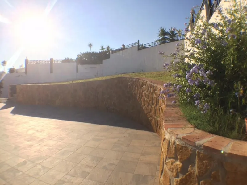 Nestled in the serene and sought-after community of Cortijos San Rafael, just off the Frigiliana road near Nerja, this outstanding detached villa—completed in 2008—offers an exceptional standard of living with stunning panoramic views of both the sea and 
