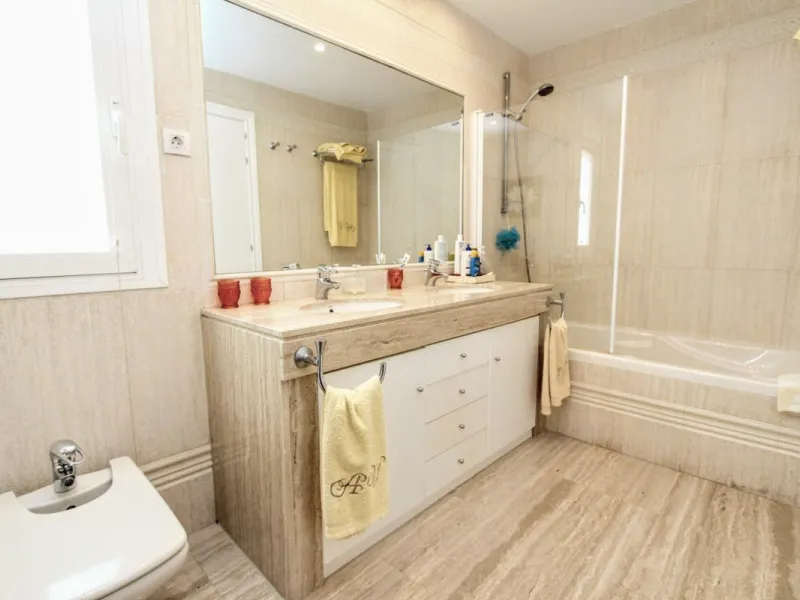 Spacious beachside villa in popular San Pedro, a short drive west of Marbella and Puerto Banús, and within walking distance of the beach promenade, shops and restaurants. This house is set in manicured gardens with a swimming pool, offering a perfect comb