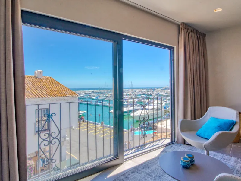 This is a simply beautiful apartment in the fashionable Marina of Puerto Banus with views over the harbour. Completely reformed to a very high standard, it comprises 2 spacious bedrooms, the Master having an ensuite bathroom and another guest bathroom, a 