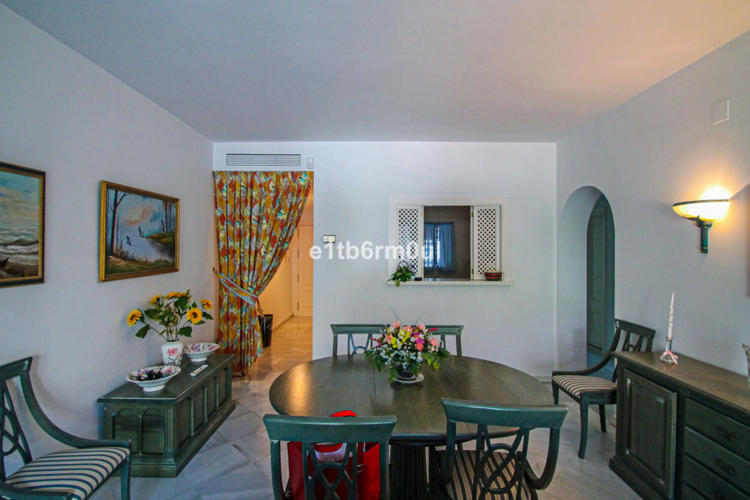 BEACHSIDE • WALKING DISTANCE TO MARBELLA CENTRE & ALL AMENITIES • Cheerful corner ground floor two bedroom apartment just steps from the beach. Located in a very desirable complex with lush mature gardens and swimming pool, right on the promenade, just a 