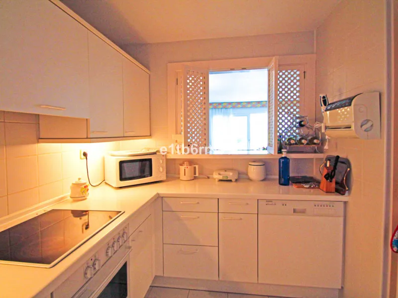 BEACHSIDE • WALKING DISTANCE TO MARBELLA CENTRE & ALL AMENITIES • Cheerful corner ground floor two bedroom apartment just steps from the beach. Located in a very desirable complex with lush mature gardens and swimming pool, right on the promenade, just a 