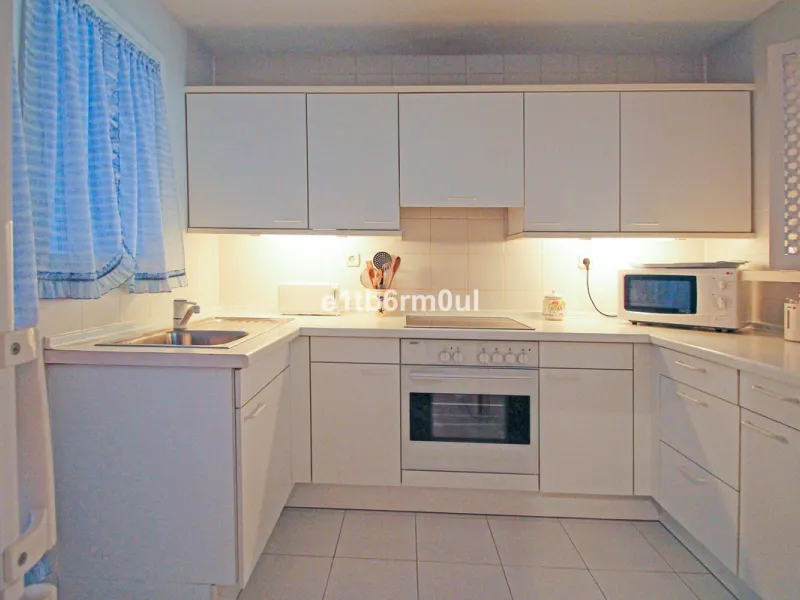 BEACHSIDE • WALKING DISTANCE TO MARBELLA CENTRE & ALL AMENITIES • Cheerful corner ground floor two bedroom apartment just steps from the beach. Located in a very desirable complex with lush mature gardens and swimming pool, right on the promenade, just a 