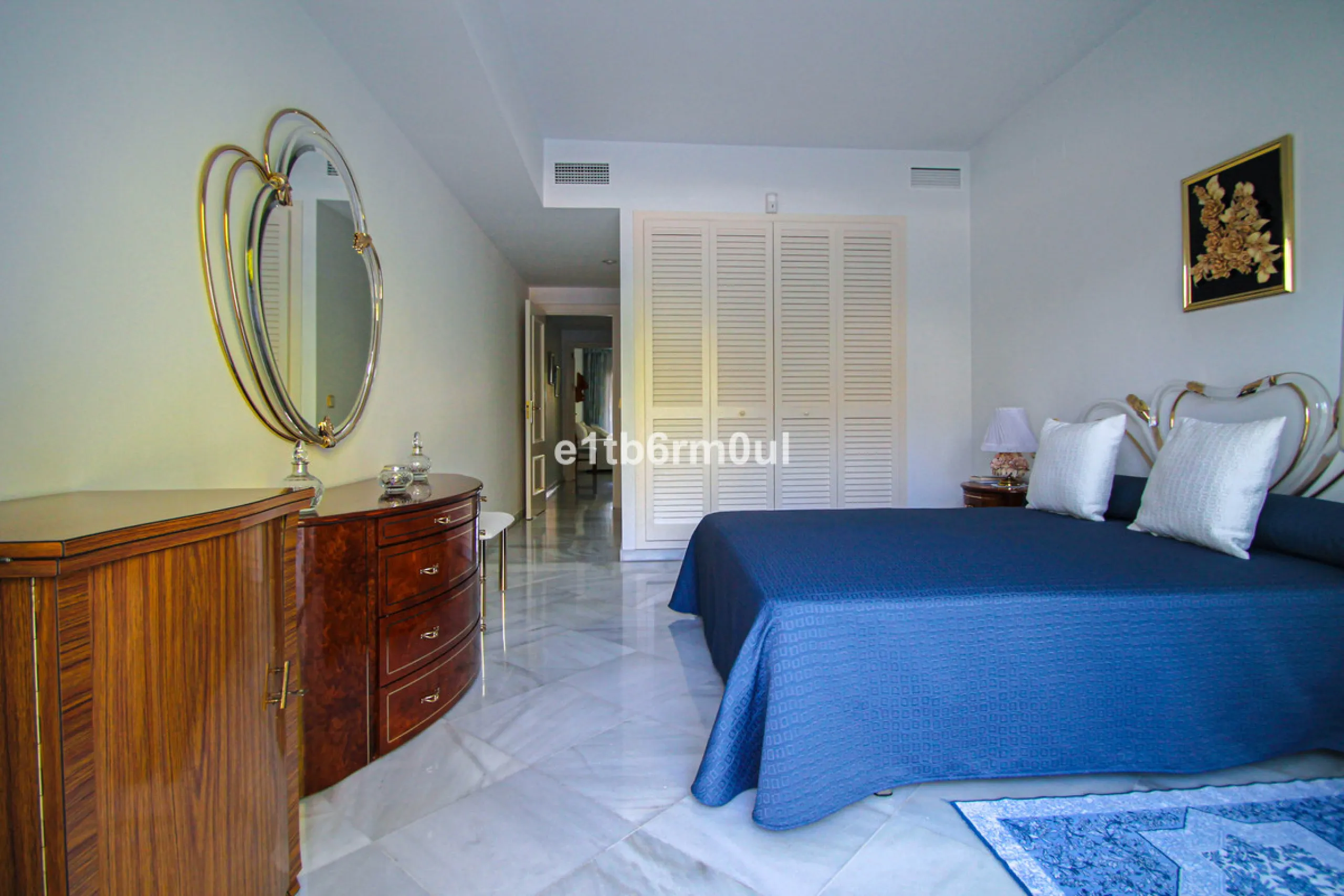 BEACHSIDE • WALKING DISTANCE TO MARBELLA CENTRE & ALL AMENITIES • Cheerful corner ground floor two bedroom apartment just steps from the beach. Located in a very desirable complex with lush mature gardens and swimming pool, right on the promenade, just a 