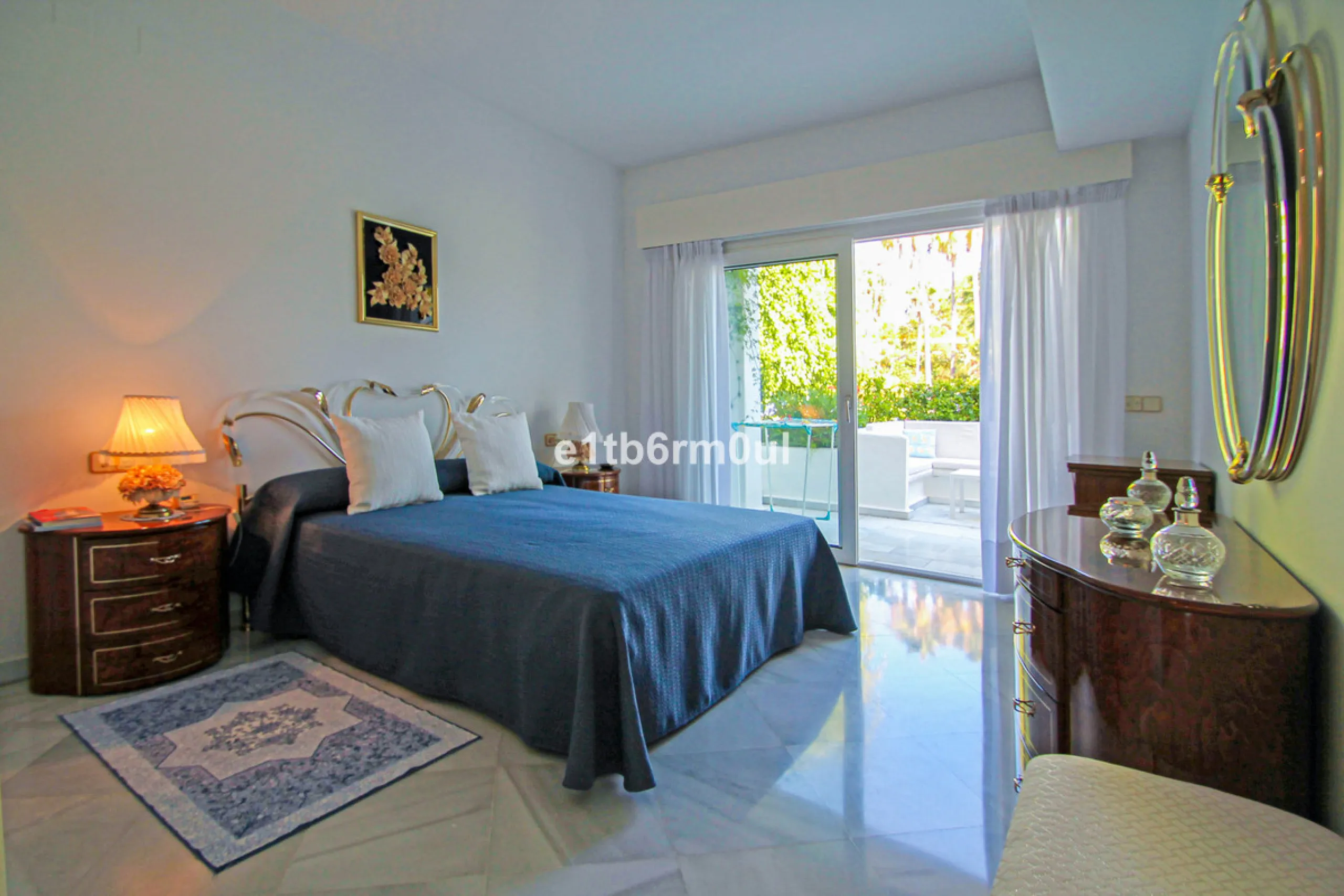 BEACHSIDE • WALKING DISTANCE TO MARBELLA CENTRE & ALL AMENITIES • Cheerful corner ground floor two bedroom apartment just steps from the beach. Located in a very desirable complex with lush mature gardens and swimming pool, right on the promenade, just a 