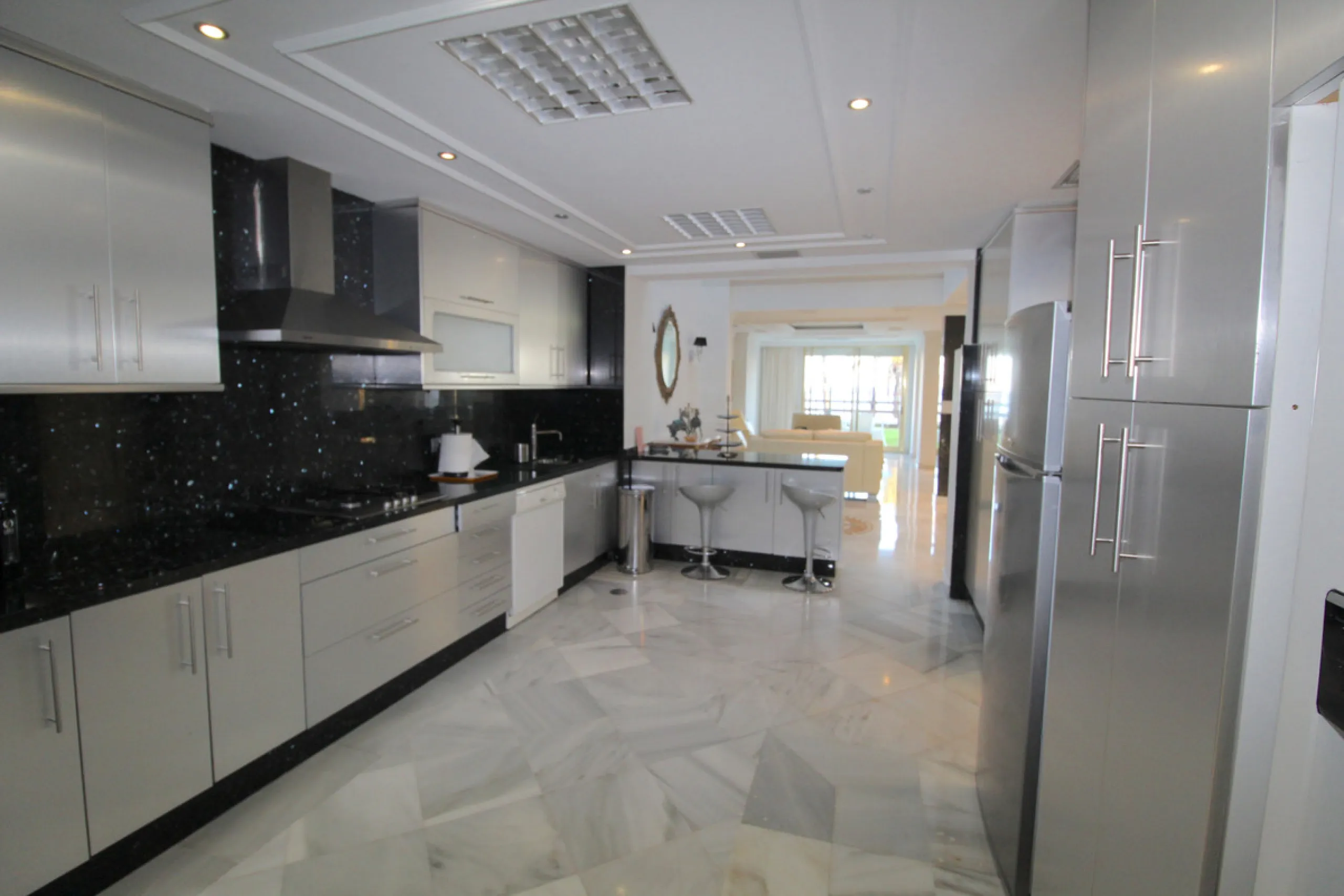 Stunning 4 bedroom duplex apartment in a beachfront urbanisation just a few steps from the heart of Puerto Banus. The apartment is located directly to the beach,   with stunning panoramic sea and beach views. The property has 4 ensuite bedrooms with fitte