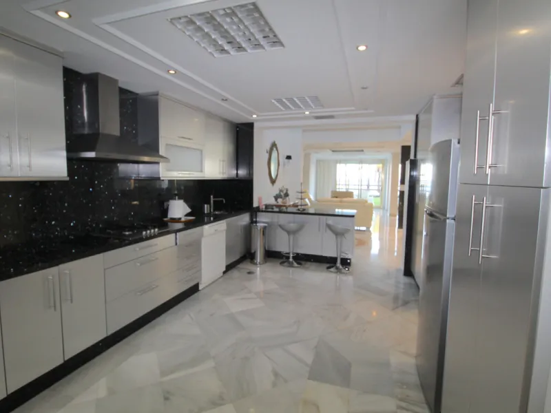 Stunning 4 bedroom duplex apartment in a beachfront urbanisation just a few steps from the heart of Puerto Banus. The apartment is located directly to the beach,   with stunning panoramic sea and beach views. The property has 4 ensuite bedrooms with fitte