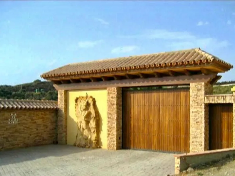 Private Estate of 4,250 m²** with a swimming pool, covered parking, sea-view lookout, barbecue oven, and terrace with views. The house spans 650 m² over three floors: equipped kitchen, living room, dining room for 10, study, suite with bathroom, 4 double 