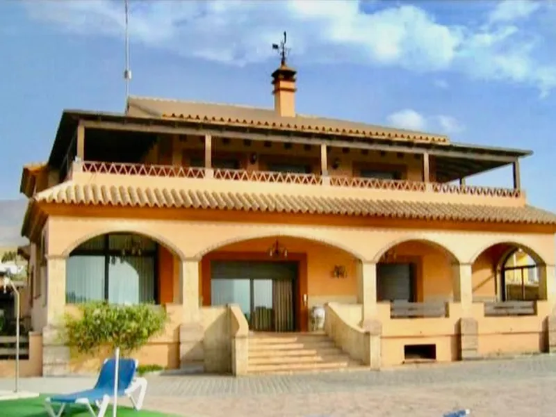 Private Estate of 4,250 m²** with a swimming pool, covered parking, sea-view lookout, barbecue oven, and terrace with views. The house spans 650 m² over three floors: equipped kitchen, living room, dining room for 10, study, suite with bathroom, 4 double 