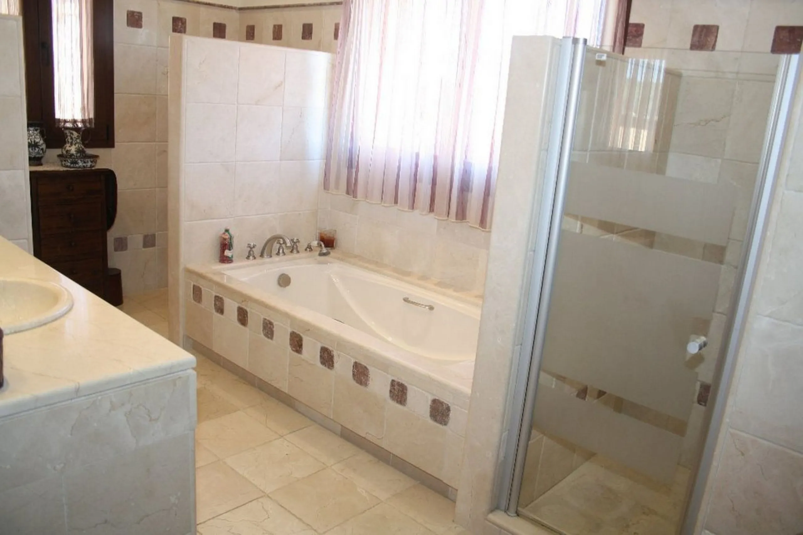 Private Estate of 4,250 m²** with a swimming pool, covered parking, sea-view lookout, barbecue oven, and terrace with views. The house spans 650 m² over three floors: equipped kitchen, living room, dining room for 10, study, suite with bathroom, 4 double 