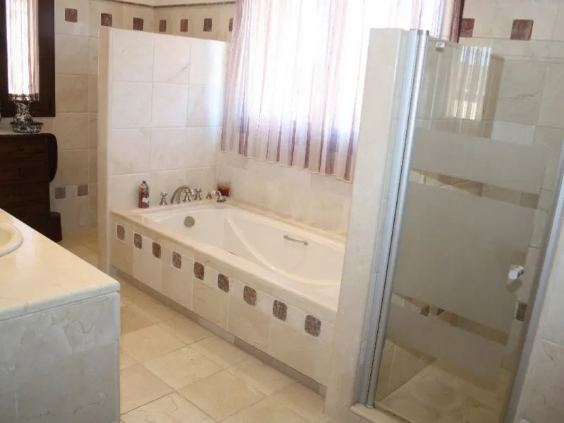 Private Estate of 4,250 m²** with a swimming pool, covered parking, sea-view lookout, barbecue oven, and terrace with views. The house spans 650 m² over three floors: equipped kitchen, living room, dining room for 10, study, suite with bathroom, 4 double 