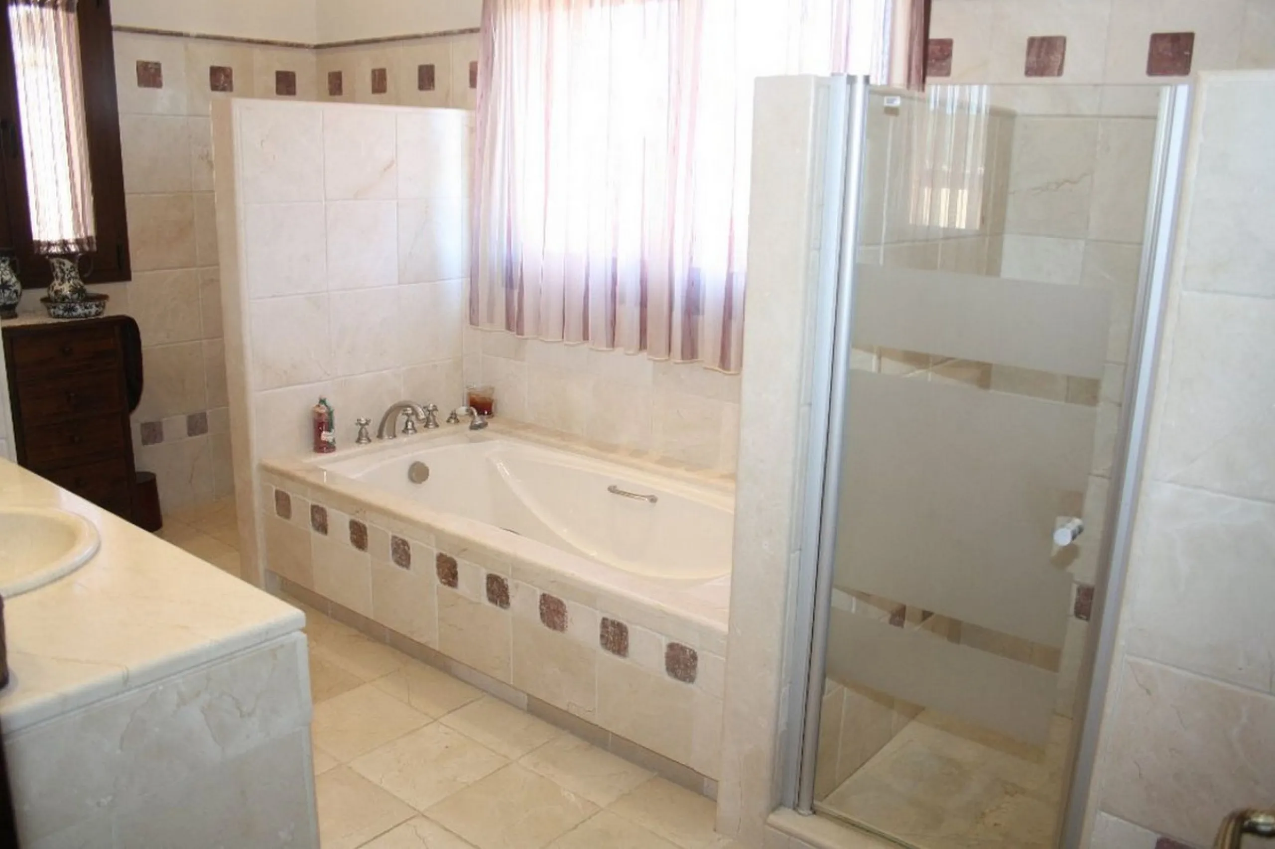 Private Estate of 4,250 m²** with a swimming pool, covered parking, sea-view lookout, barbecue oven, and terrace with views. The house spans 650 m² over three floors: equipped kitchen, living room, dining room for 10, study, suite with bathroom, 4 double 
