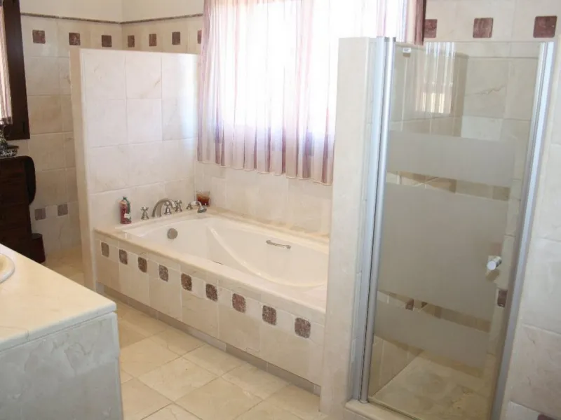 Private Estate of 4,250 m²** with a swimming pool, covered parking, sea-view lookout, barbecue oven, and terrace with views. The house spans 650 m² over three floors: equipped kitchen, living room, dining room for 10, study, suite with bathroom, 4 double 