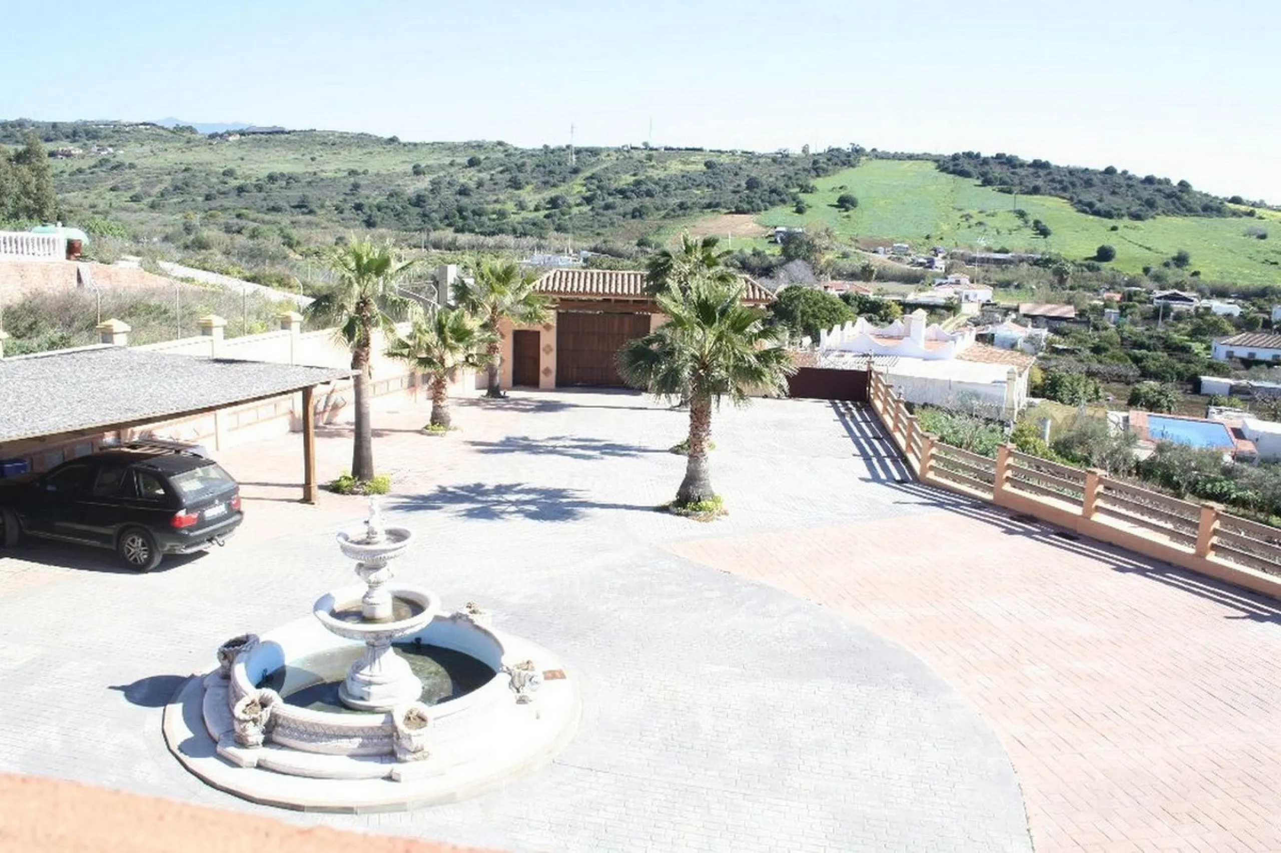 Private Estate of 4,250 m²** with a swimming pool, covered parking, sea-view lookout, barbecue oven, and terrace with views. The house spans 650 m² over three floors: equipped kitchen, living room, dining room for 10, study, suite with bathroom, 4 double 
