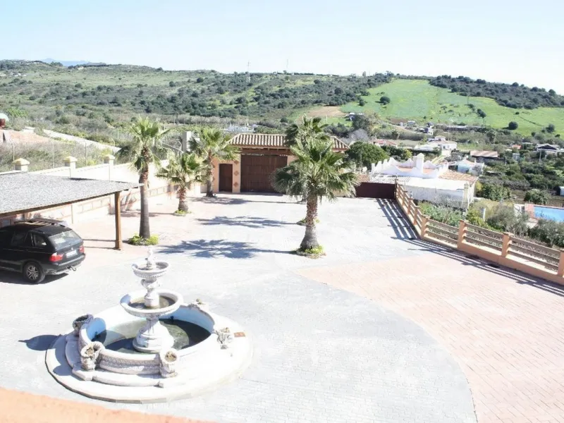 Private Estate of 4,250 m²** with a swimming pool, covered parking, sea-view lookout, barbecue oven, and terrace with views. The house spans 650 m² over three floors: equipped kitchen, living room, dining room for 10, study, suite with bathroom, 4 double 